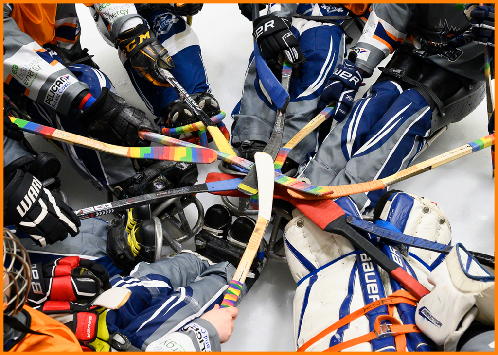 Sheffield Steelkings players put their sticks in before the start of a game.