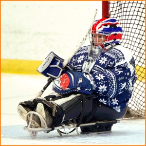 Bryan, wearing his Christmas Jumper Jersey, prepares himself in the net before a game